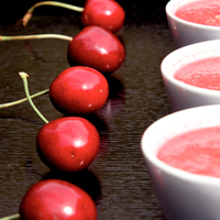 Cherry gazpacho served in small white espreso cups