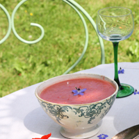 gazpacho bowl and peaches in a tray